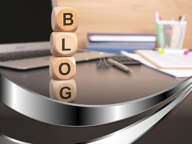 Letter blocks stacked on a desk spelling out the word "blog" to direct users to CCTY's blogs.